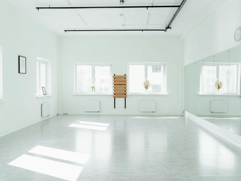 Bright and clean exercise studio with wooden floors