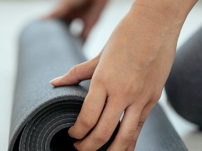 Detailed view of hands and mat during exercise